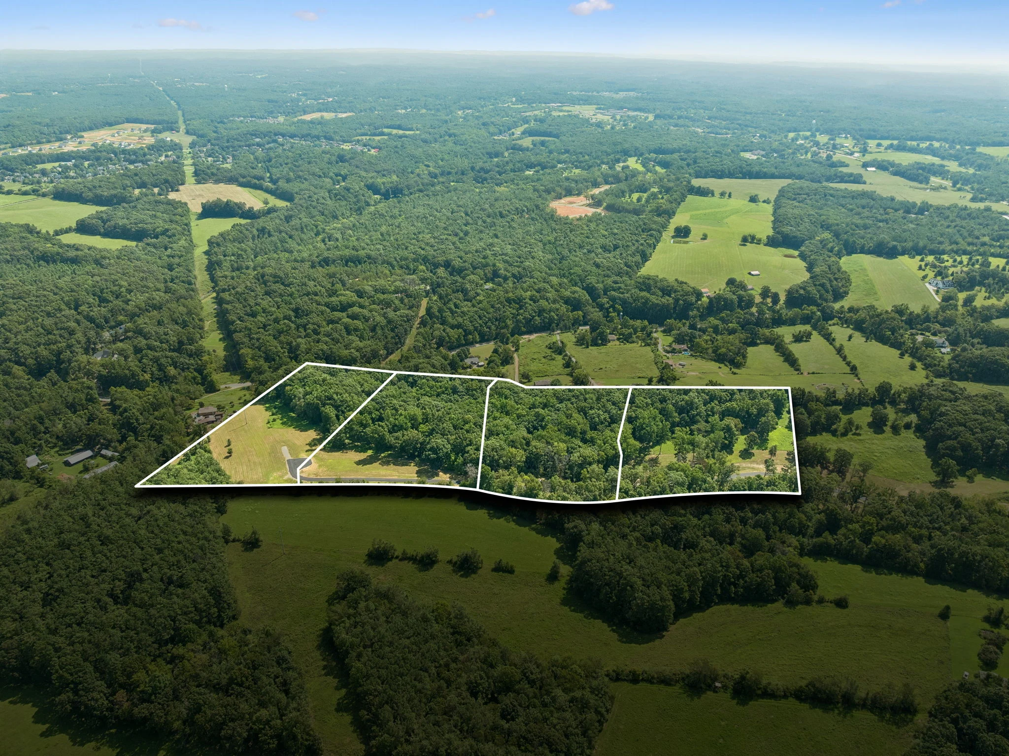 Aerial view of the green countryside surrounding Curitiba Plateau